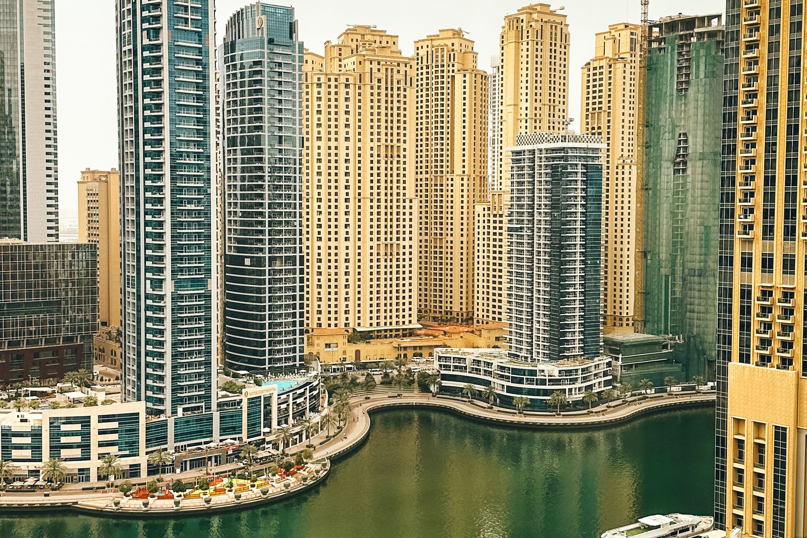 High-rise towers along the Dubai Marina waterfront, overlooking the water