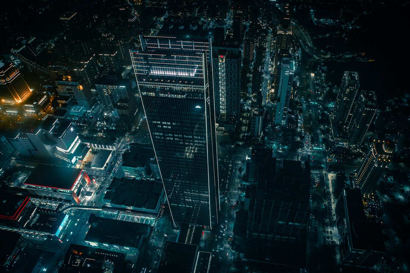 Aerial night view of an illuminated city financial district