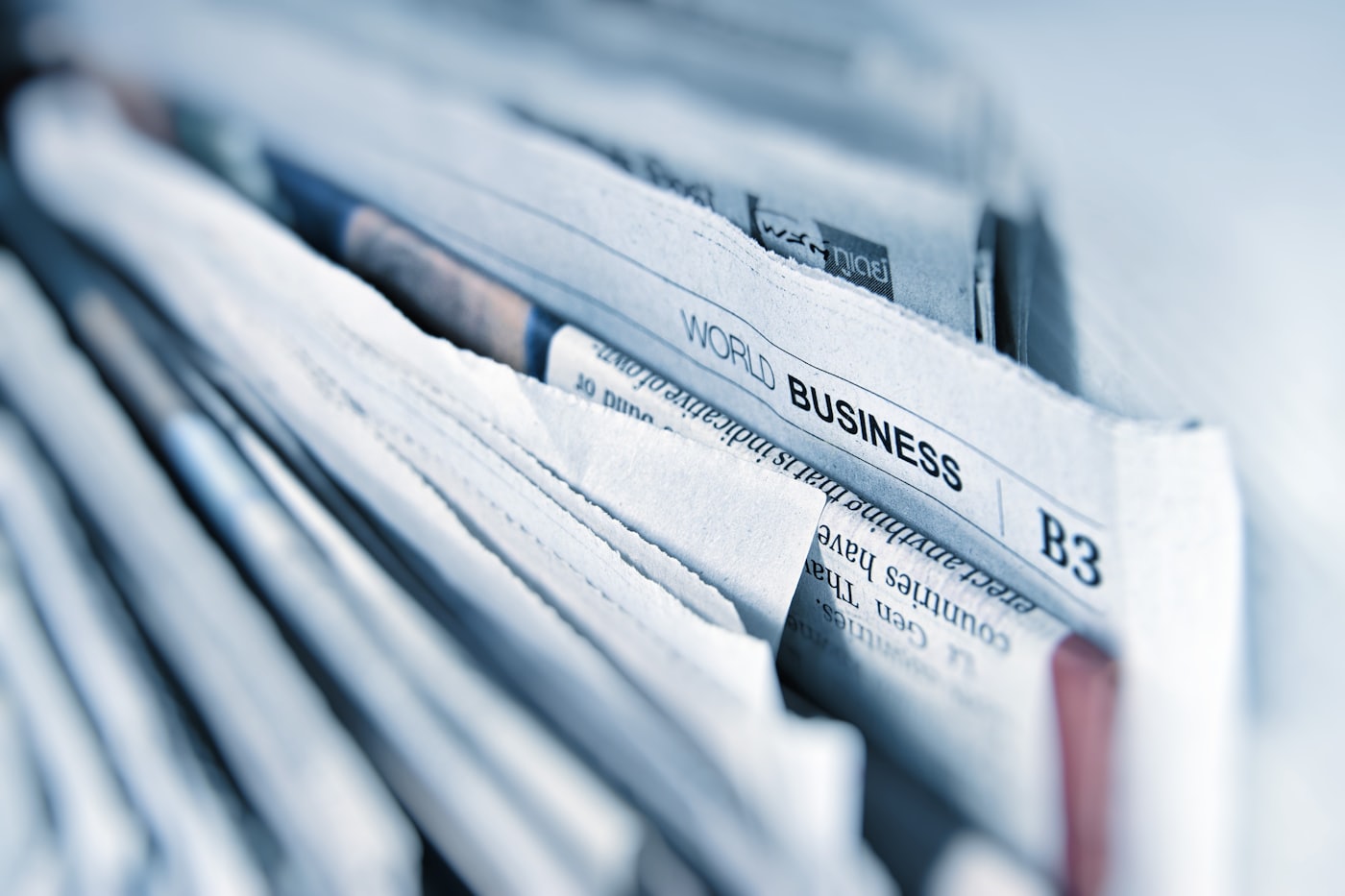 Close-up of a stack of folded business newspapers
