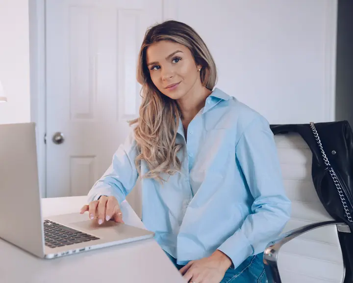 A woman working at a laptop